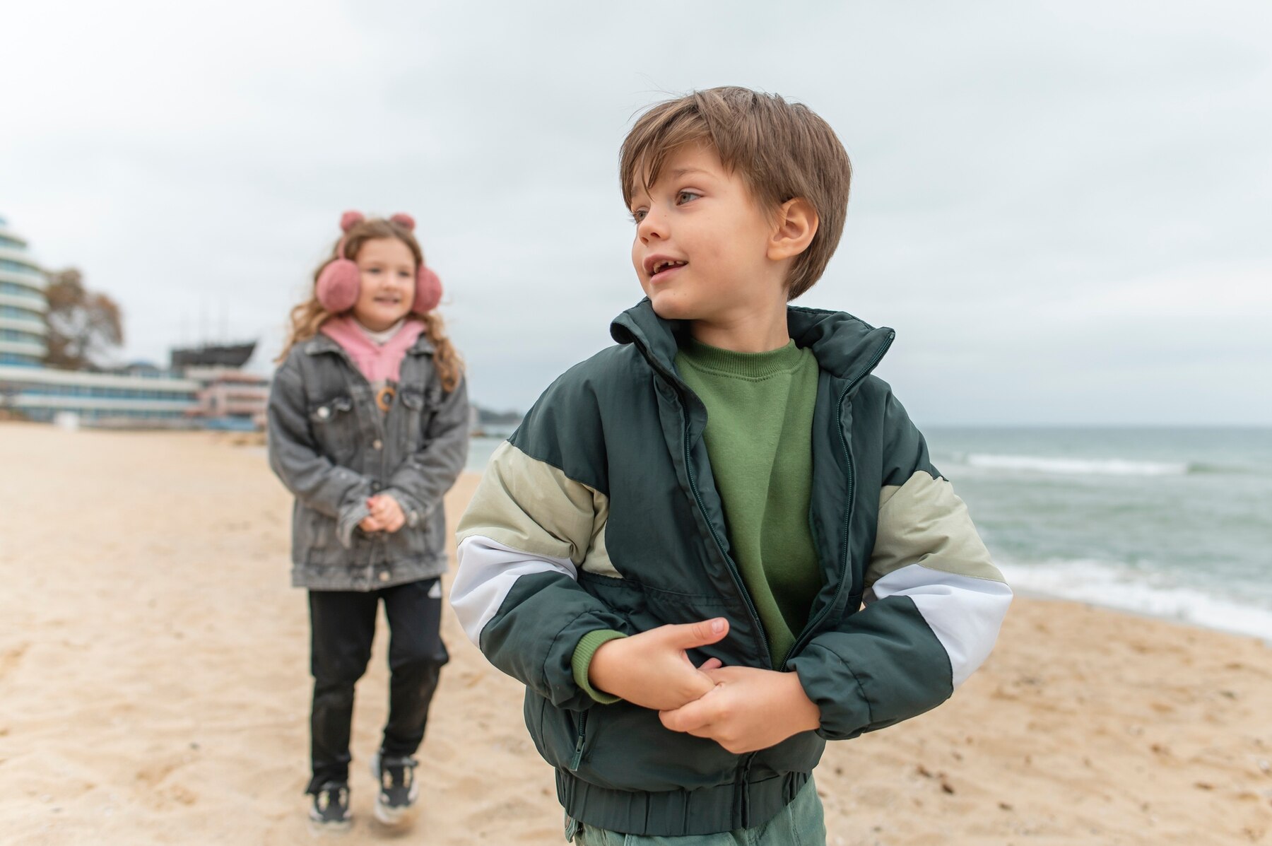 children-having-fun-together-by-sea_23-2149214066